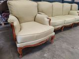 two couches and a chair in a room