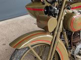 a motorcycle that is parked in front of a garage door