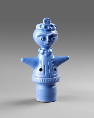 blue ceramic figurine of a woman with a hat on her head