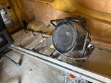 an image of a work bench with a fan on top of it