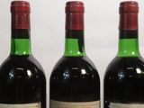 three bottles of wine sitting next to each other on a table