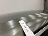 a measuring tape on a conveyor belt at the airport