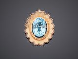 an aquamarinee and gold broochle