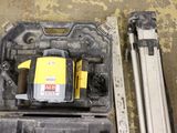 a yellow and black laser level in a plastic case