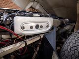 a close up of a car ' s engine in the back of a truck