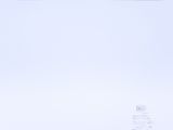 a man riding a snowboard down a snow covered slope