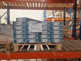 a pallet full of boxes of wood in a warehouse