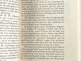 an open book with a picture of a cat on it
