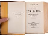 someone is holding a book open to show the title of the book