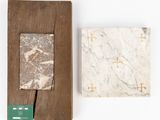 two pieces of marble and wood are sitting next to each other
