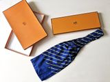 a tie and a box on a white table