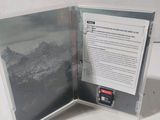 a picture of a book opened to show a picture of a mountain range
