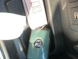 a cell phone that is sitting in the center console of a car