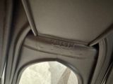 a close up of a seat in a car with a window open