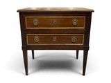 a small wooden chest of drawers on a white background