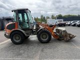 an image of a tractor that is parked in a parking lot