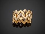 a close up of a gold ring on a black surface