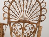 a wicker chair that is sitting on a tile floor