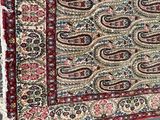 an image of a large oriental rug with a paisley design