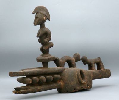 a close up of a sculpture of a person on a boat