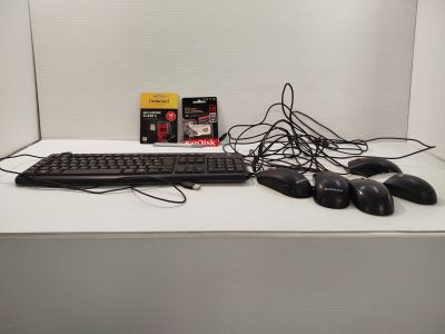 a computer keyboard and mouse sitting on a desk