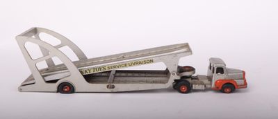 a toy truck with a ramp attached to the back of it