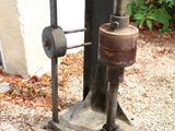 a small machine that is on the ground by a building