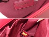 two pictures of a red bag with a white cat sitting on top of it