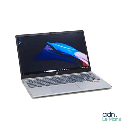a laptop that is sitting on a white surface