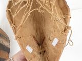 a person that is holding a bag that has some string on it