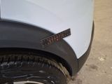 a sticker on the side of a white truck