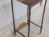 a small table with a piece of wood on it
