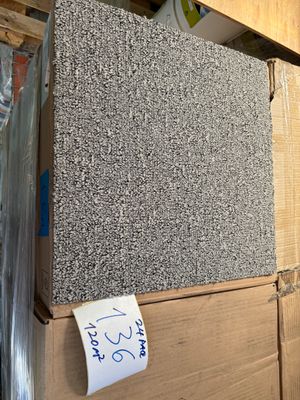 a box of granite sitting on top of a cardboard box
