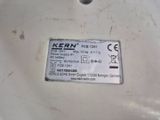a close up of a label on a white sink