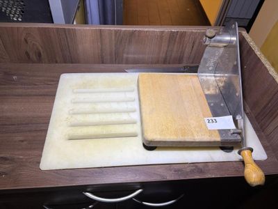 a cutting board and a knife on a cutting board