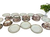 a lot of plates that are sitting on the table