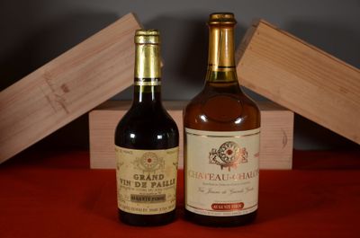 two bottles of wine sitting next to each other on a table