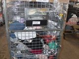 a metal cart with many items in it in a warehouse