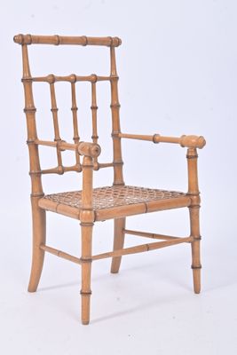 a wooden chair with a woven seat on a white background