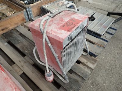 a picture of a heater sitting on top of a wooden pallet