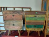 three wooden drawers stacked on top of each other in a room