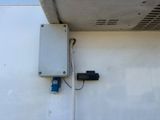 an electrical box attached to the side of a building