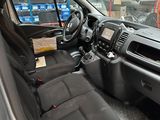 the interior of a truck with a lot of seats and a steering wheel