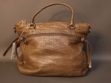 an image of a brown purse sitting on top of a table