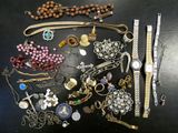 many different types of jewelry on the table