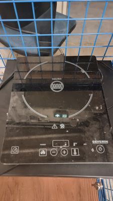 an image of a stove top in a cage