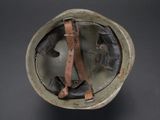 a close up of a helmet with a leather strap