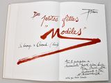 a book with a red marker on it that has writing on it