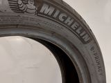 a close up of a tire on a white surface
