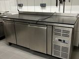 a large kitchen with stainless steel appliances in it